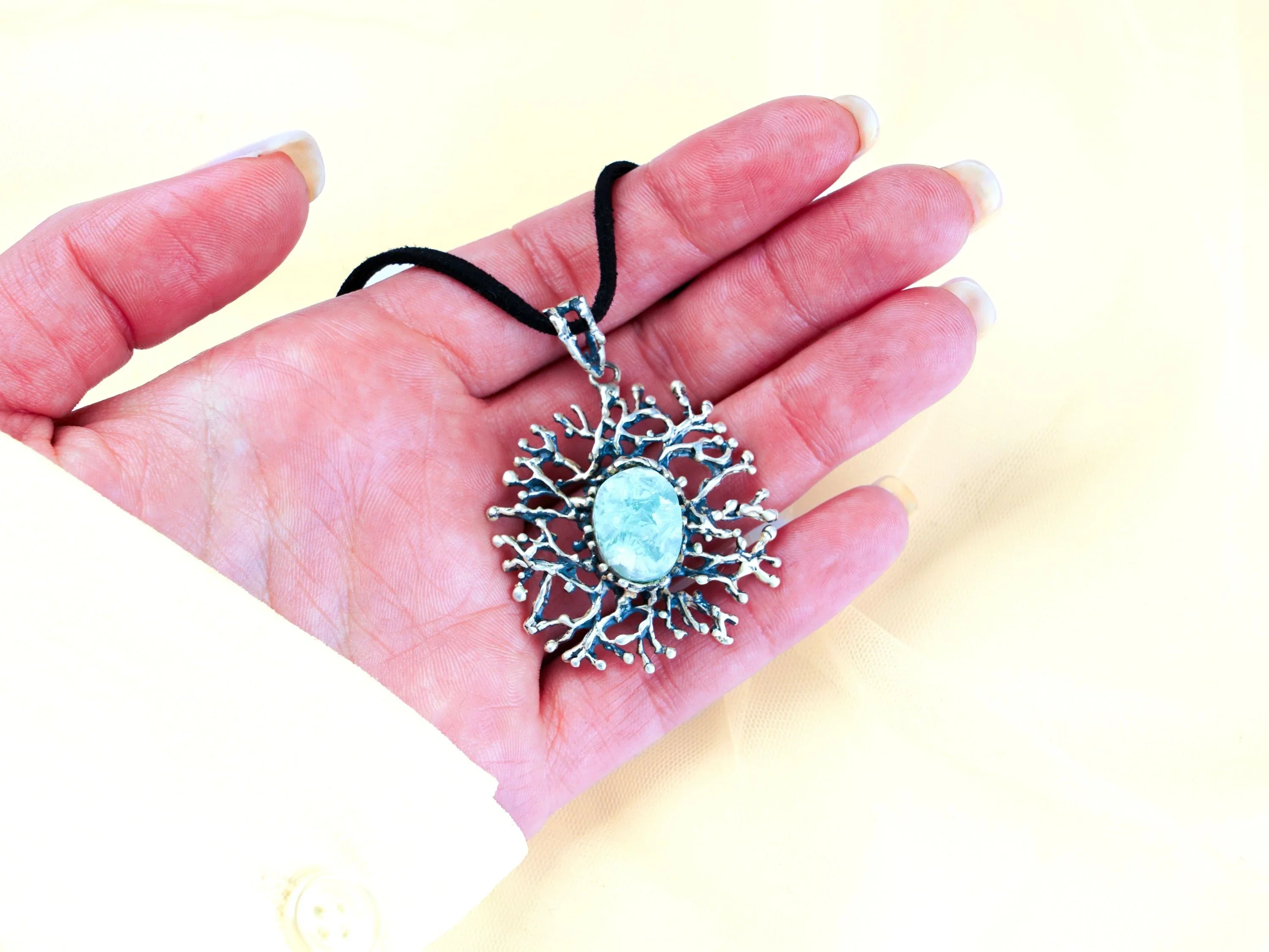 Aquamarine necklace on hand size reference sterling silver pendant