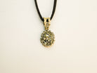 close up pyrite pendant natural gold crystal texture detail