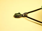 jade gemstone close up detail smooth green texture silver setting