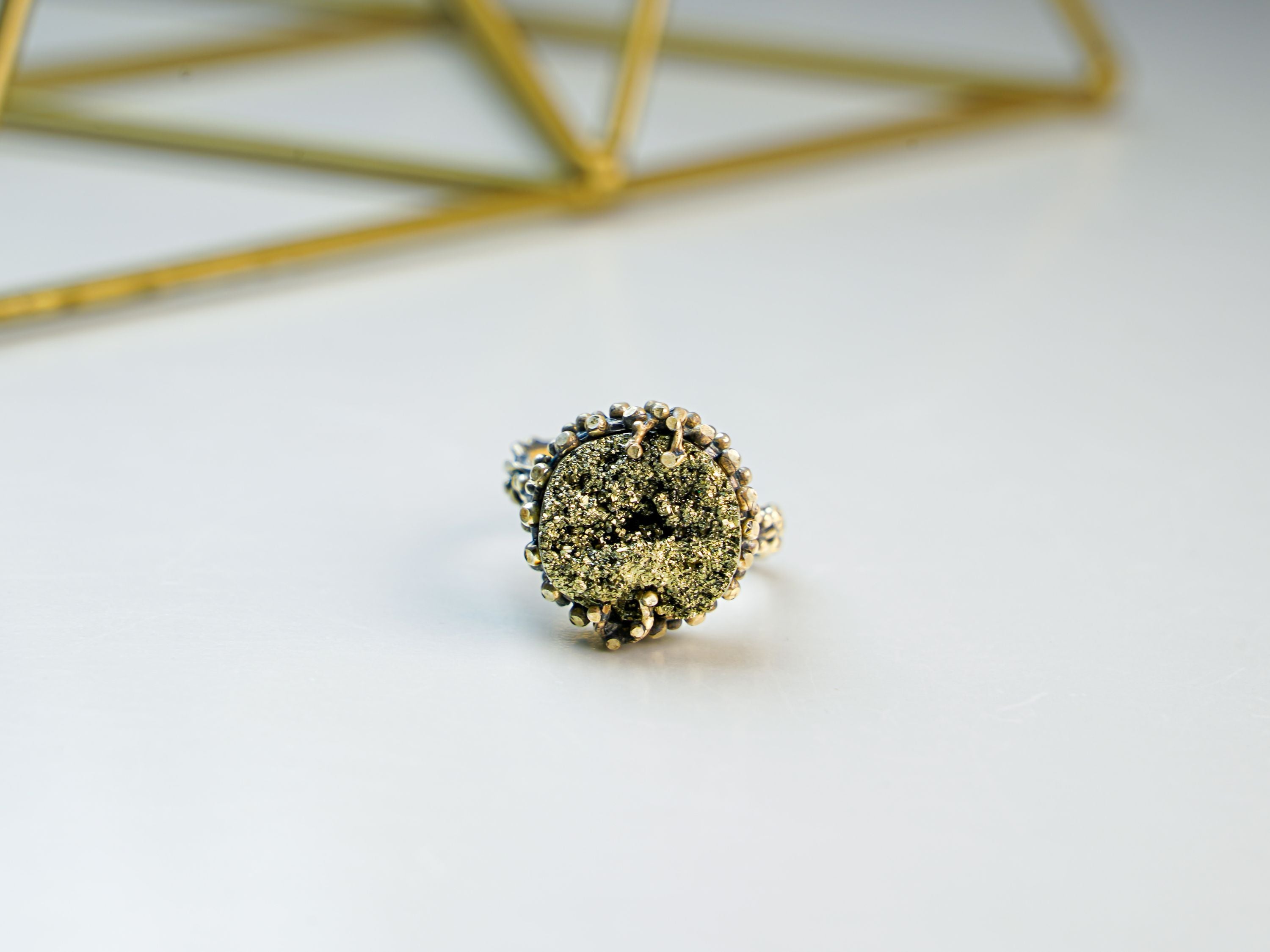 Pyrite ring close up raw gold metallic texture natural stone sterling silver ring