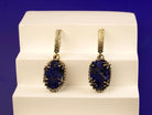 Close up lapis lazuli earrings deep blue textured stone detail silver setting
