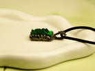 close up malachite crystal pendant natural green stone texture detail