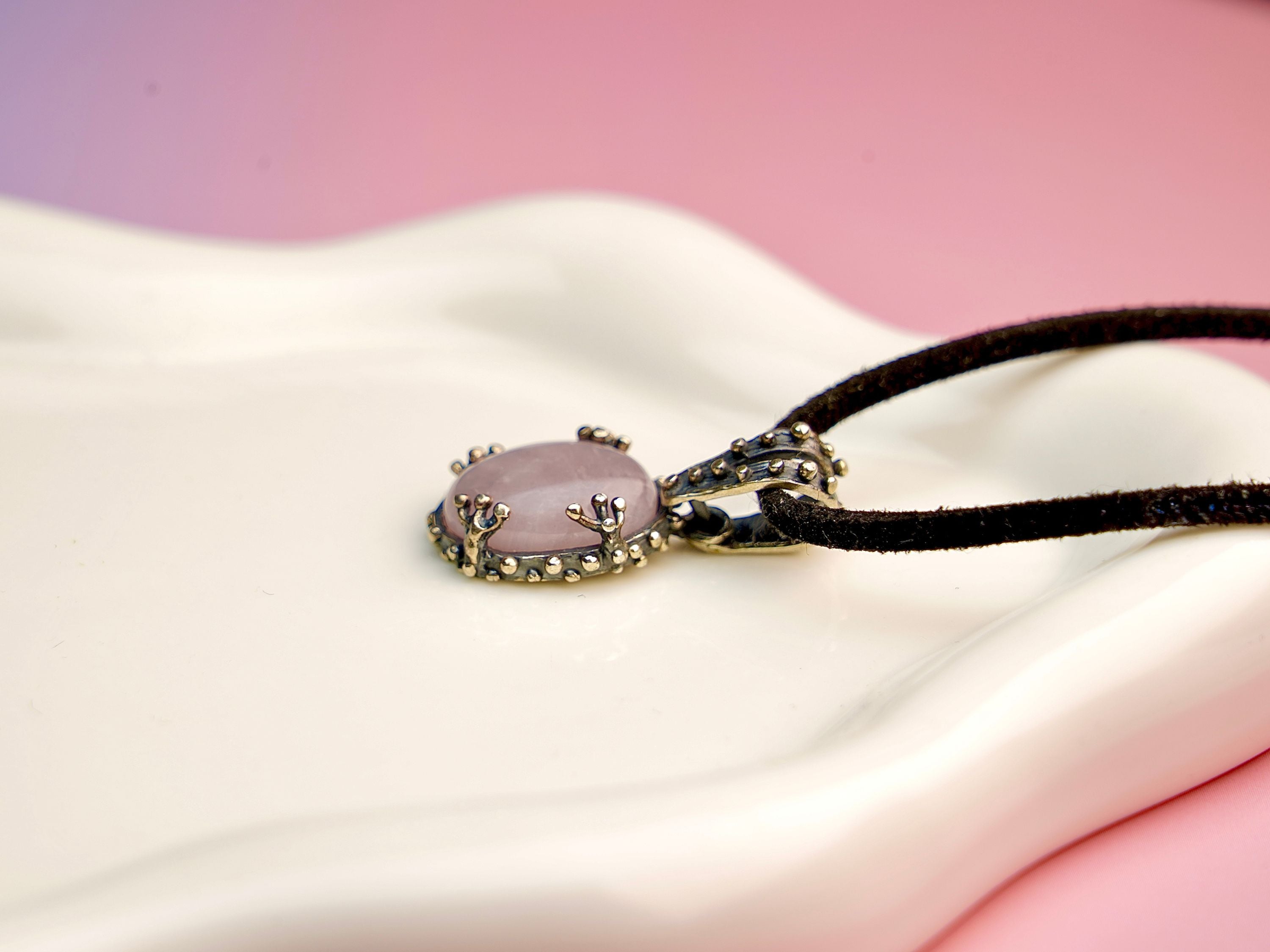 Rose quartz necklace close up detail soft pink gemstone texture sterling silver