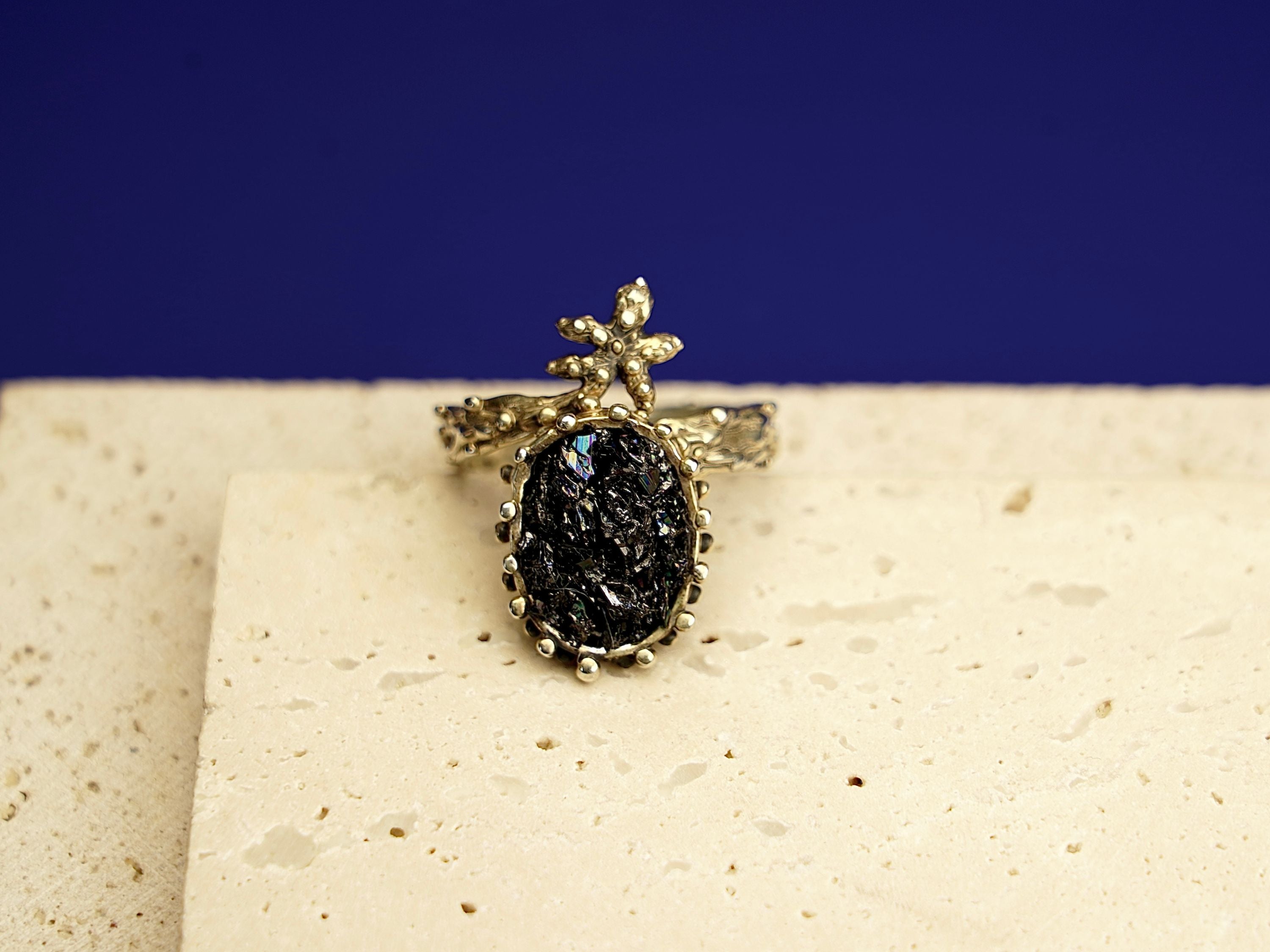 Close up black tourmaline raw gemstone texture detail sterling silver ring