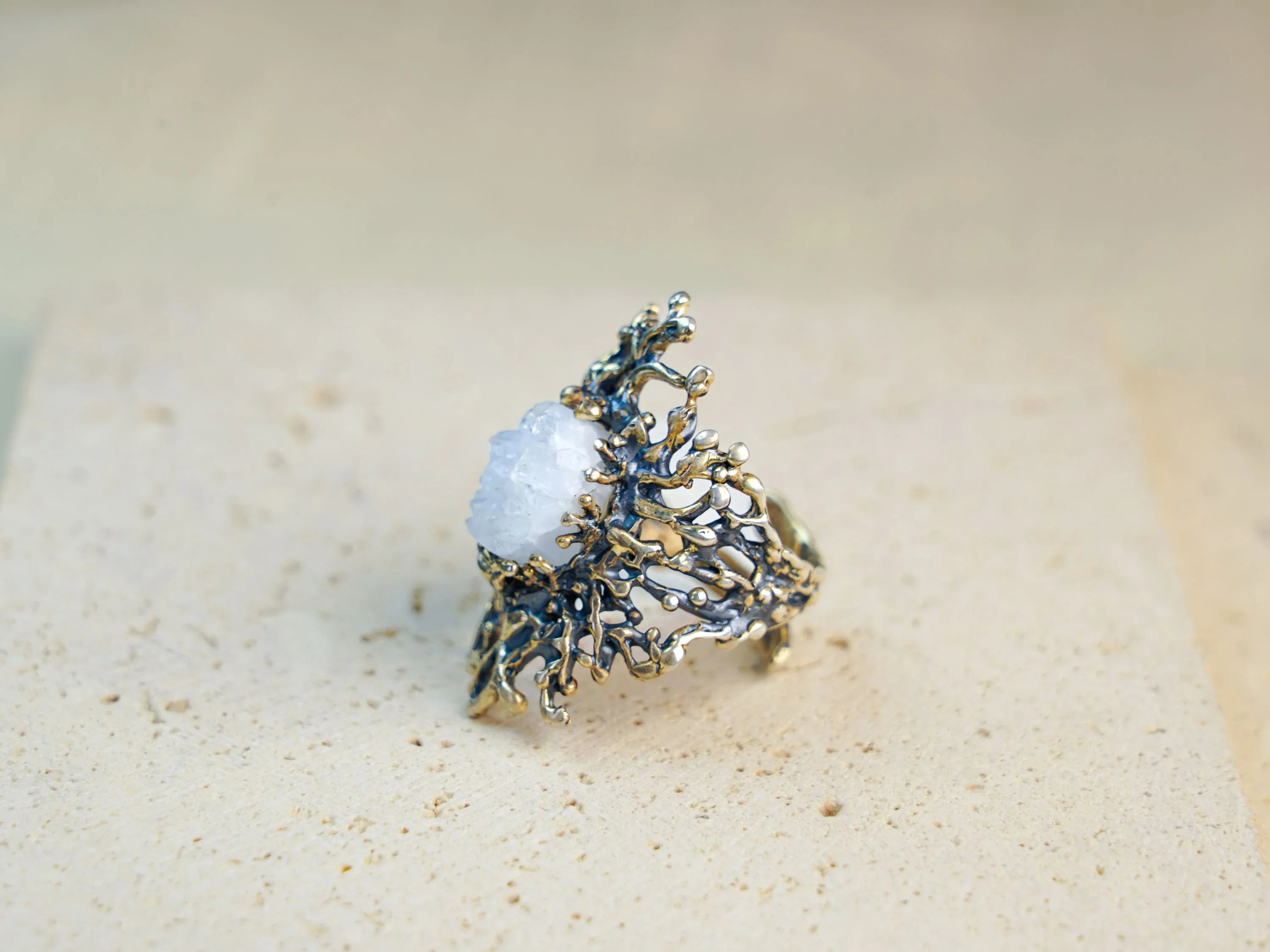 Moonstone ring angled view organic textured sterling silver artistic design