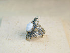 Moonstone ring angled view organic textured sterling silver artistic design