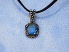 Close up labradorite pendant blue flash iridescent stone detail silver setting