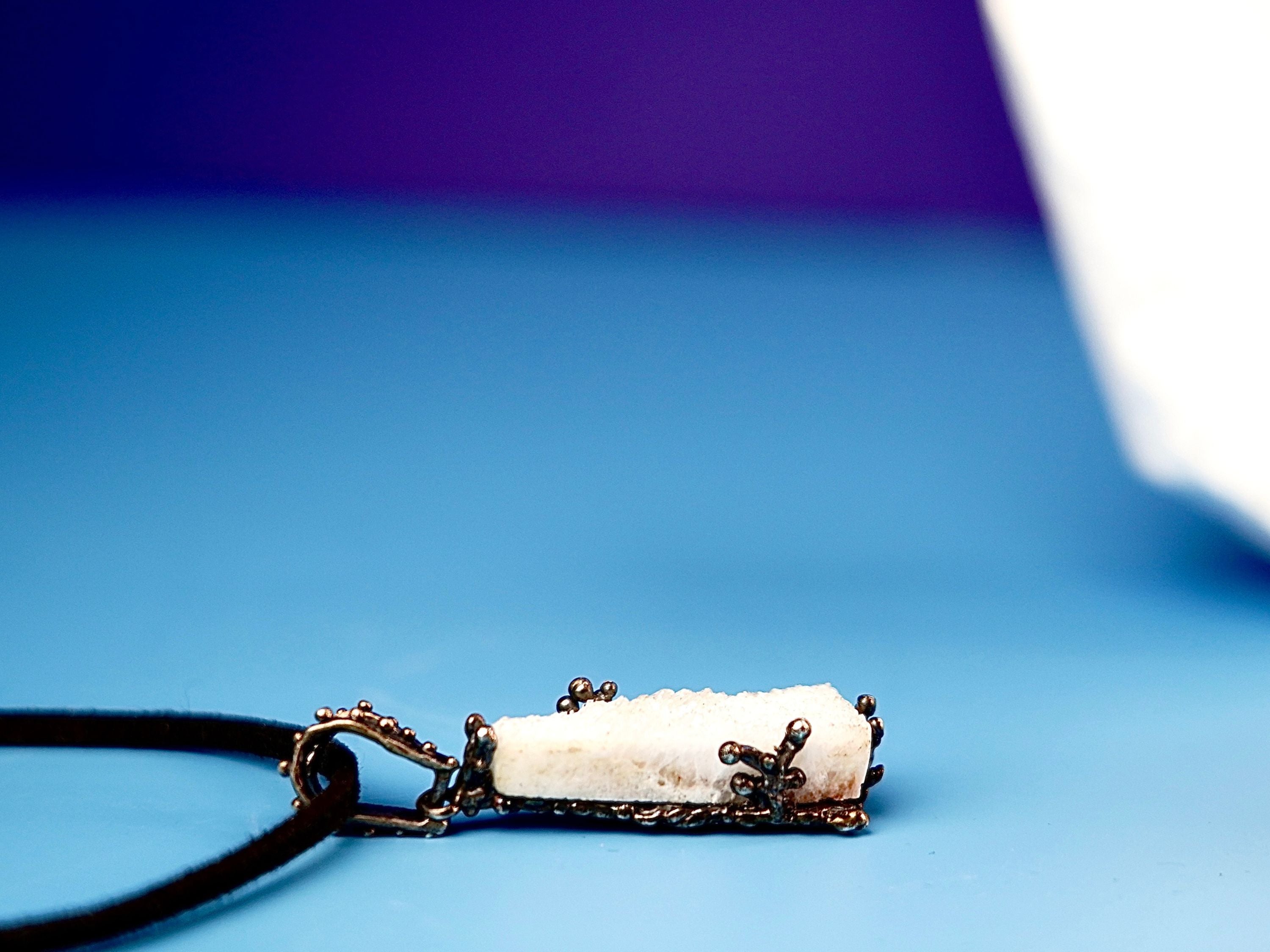 Close up moonstone crystal raw texture white gemstone detail sterling silver pendant