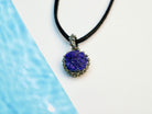 close up lapis lazuli pendant, smooth blue gemstone refined detail
