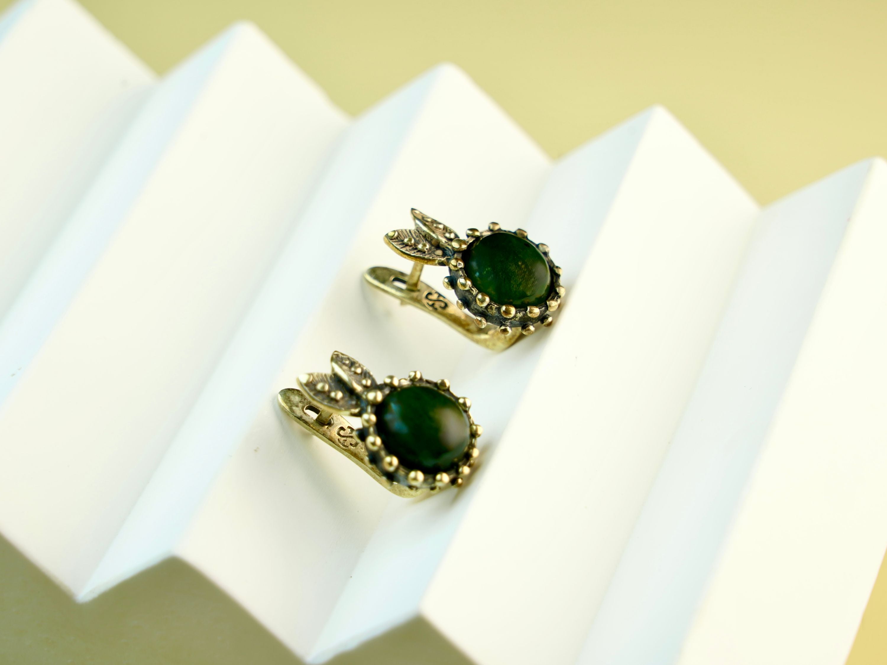 jade earrings angle view green gemstone sterling silver earrings