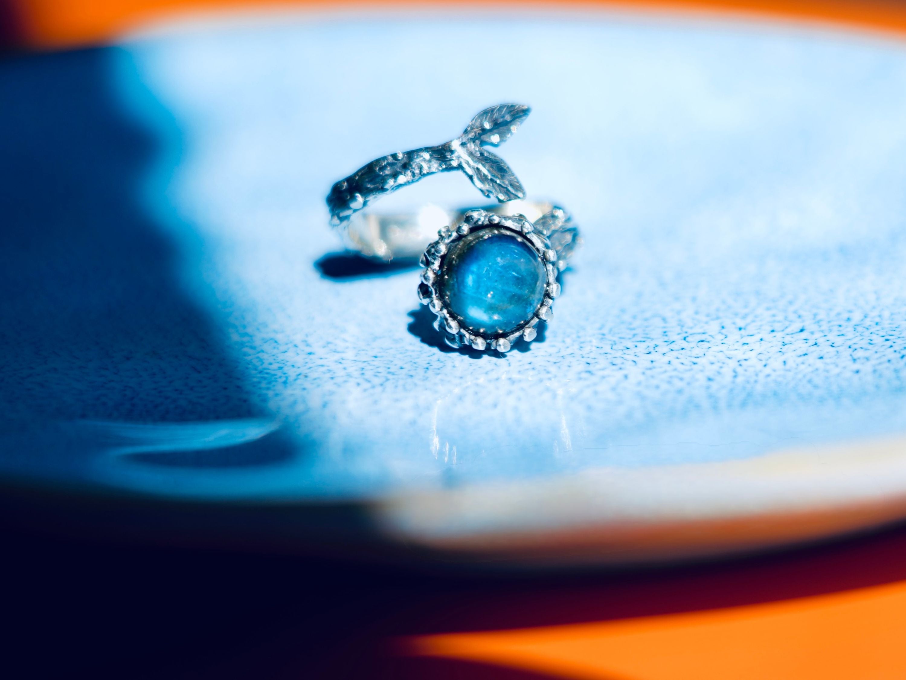 Clean front view labradorite ring blue stone silver statement jewelry minimal composition