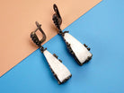 Moonstone earrings clean front view raw white crystal drop earrings minimal composition
