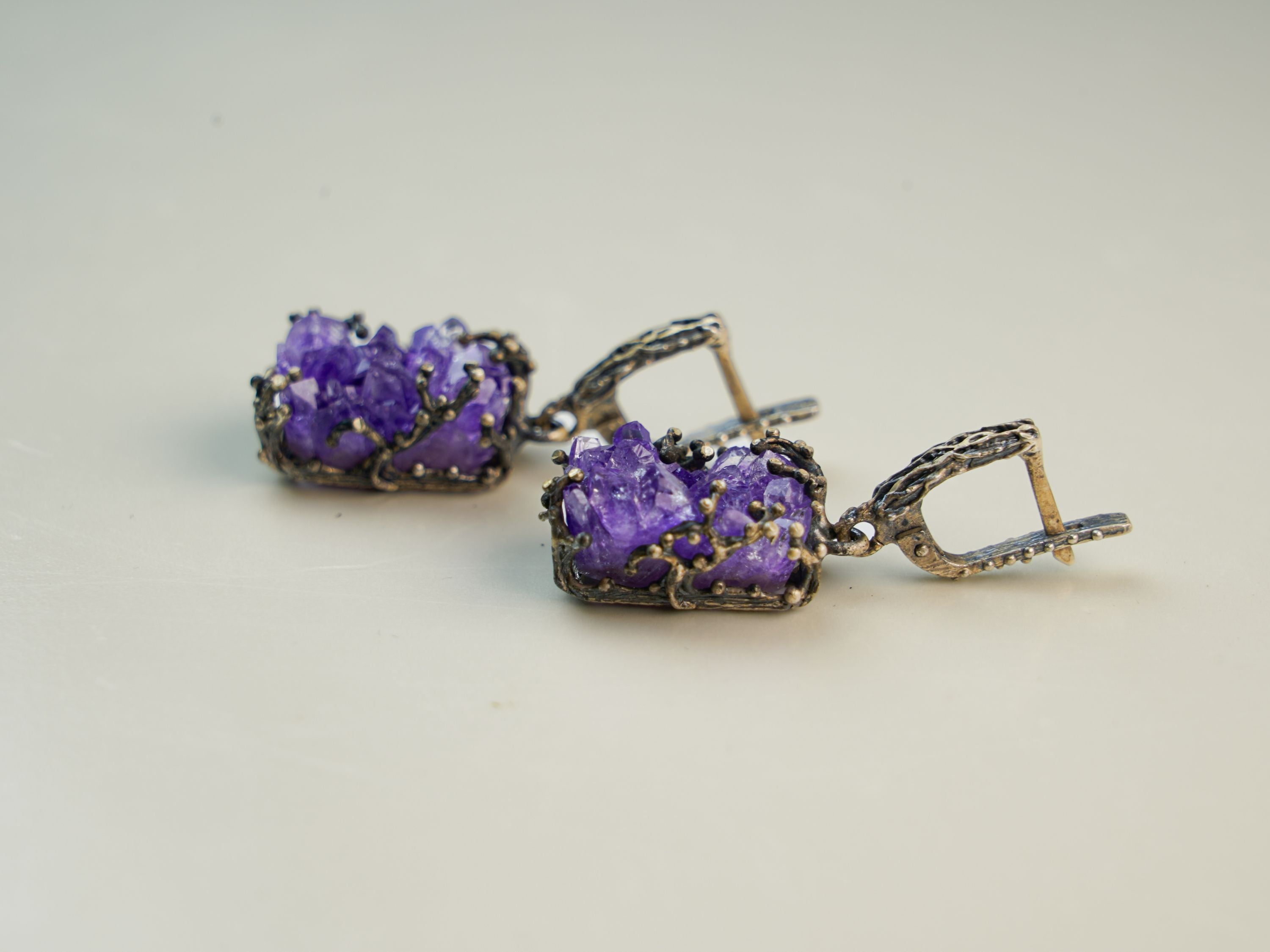 amethyst dangle earrings side angle purple gemstone elegant silver jewelry
