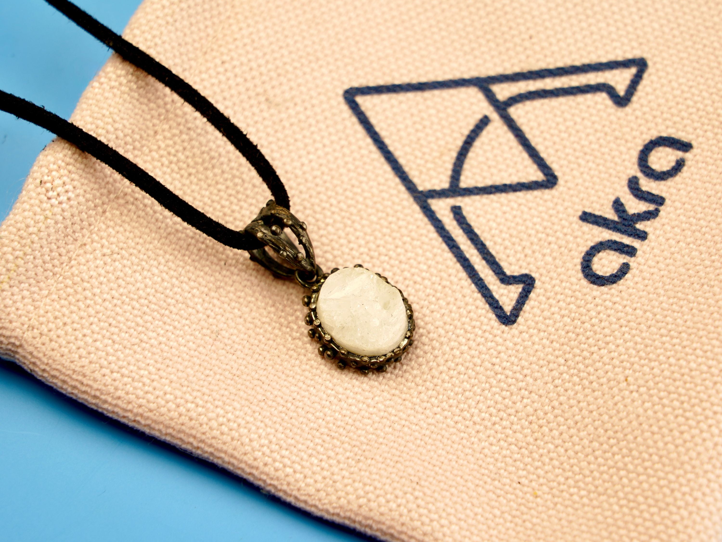 moonstone pendant necklace front view, minimal white gemstone silver design
