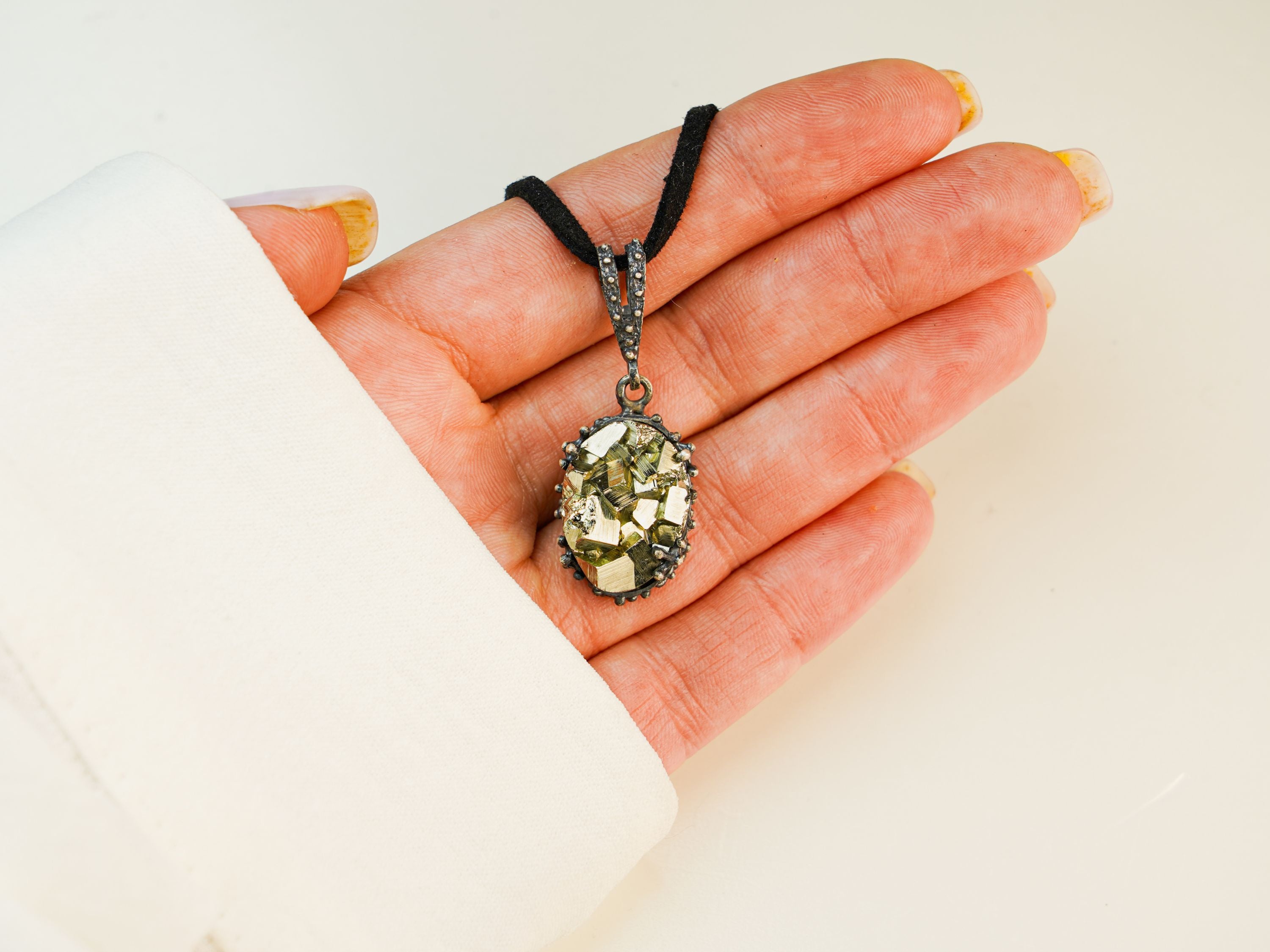 pyrite necklace in hand raw stone gold pendant sterling silver