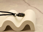 black tourmaline necklace clean minimal background gothic pendant