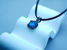 Labradorite necklace clean front view blue flash pendant minimal composition