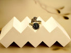 Clean front view black tourmaline statement ring adjustable silver jewelry minimal background
