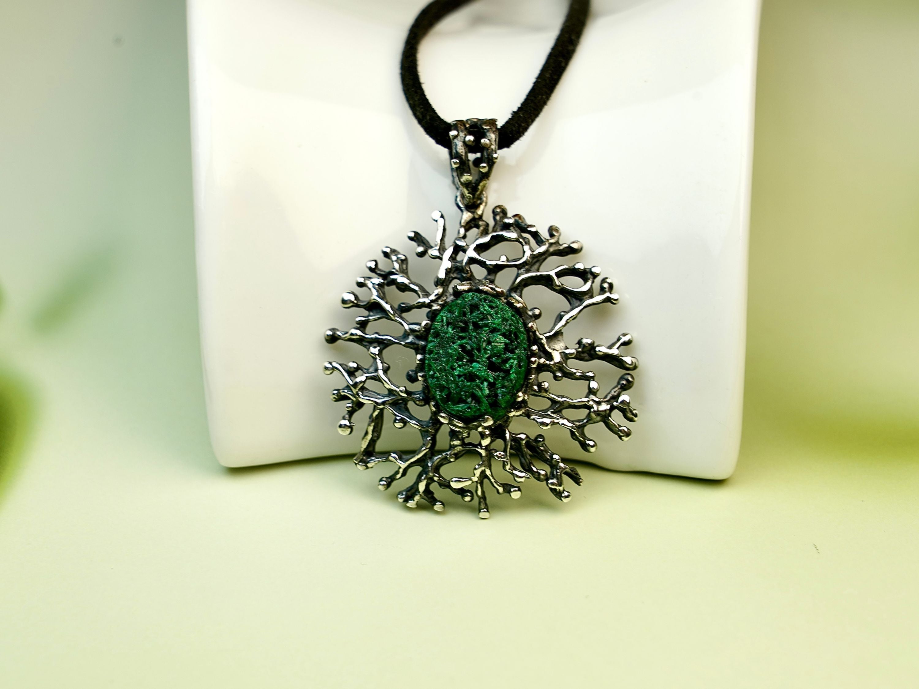 Malachite necklace clean background minimal green gemstone pendant sterling silver