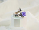 Amethyst ring angled view purple gemstone adjustable sterling silver band