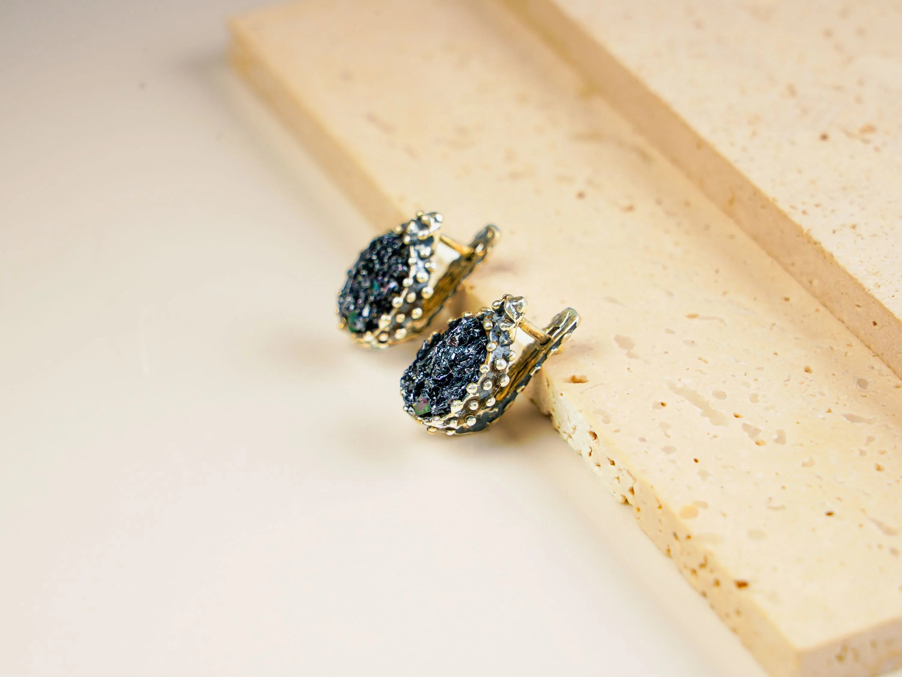 Black moissanite earrings angled view minimalist dark gemstone jewelry