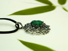 Malachite necklace angle view green gemstone pendant elegant silver jewelry
