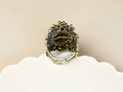 Detailed shot of the adjustable open-back silver band on the large labradorite statement ring