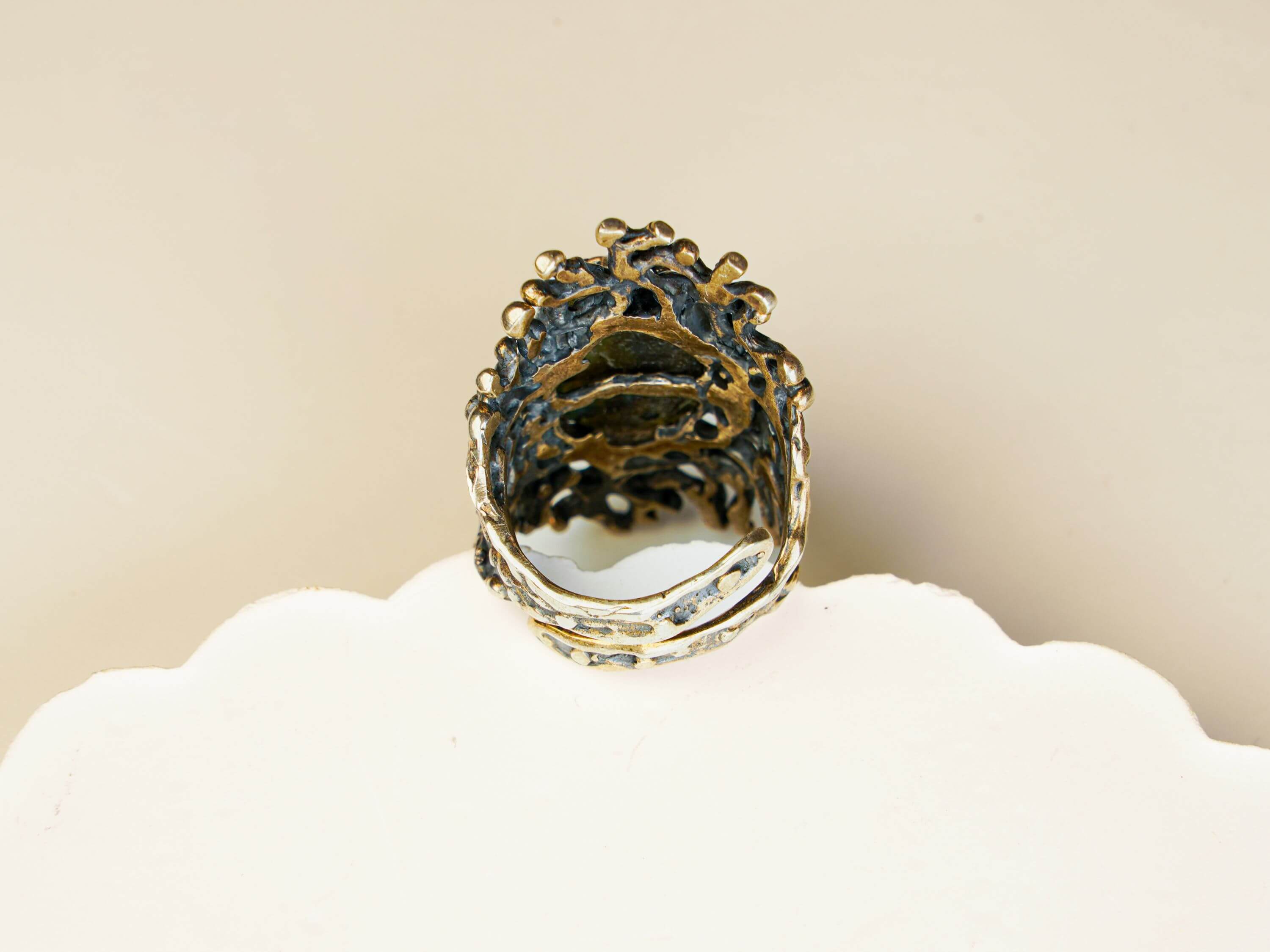 Detailed shot of the adjustable open-back silver band on the large labradorite statement ring