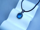 Angle view labradorite pendant blue flash gemstone silver necklace perspective