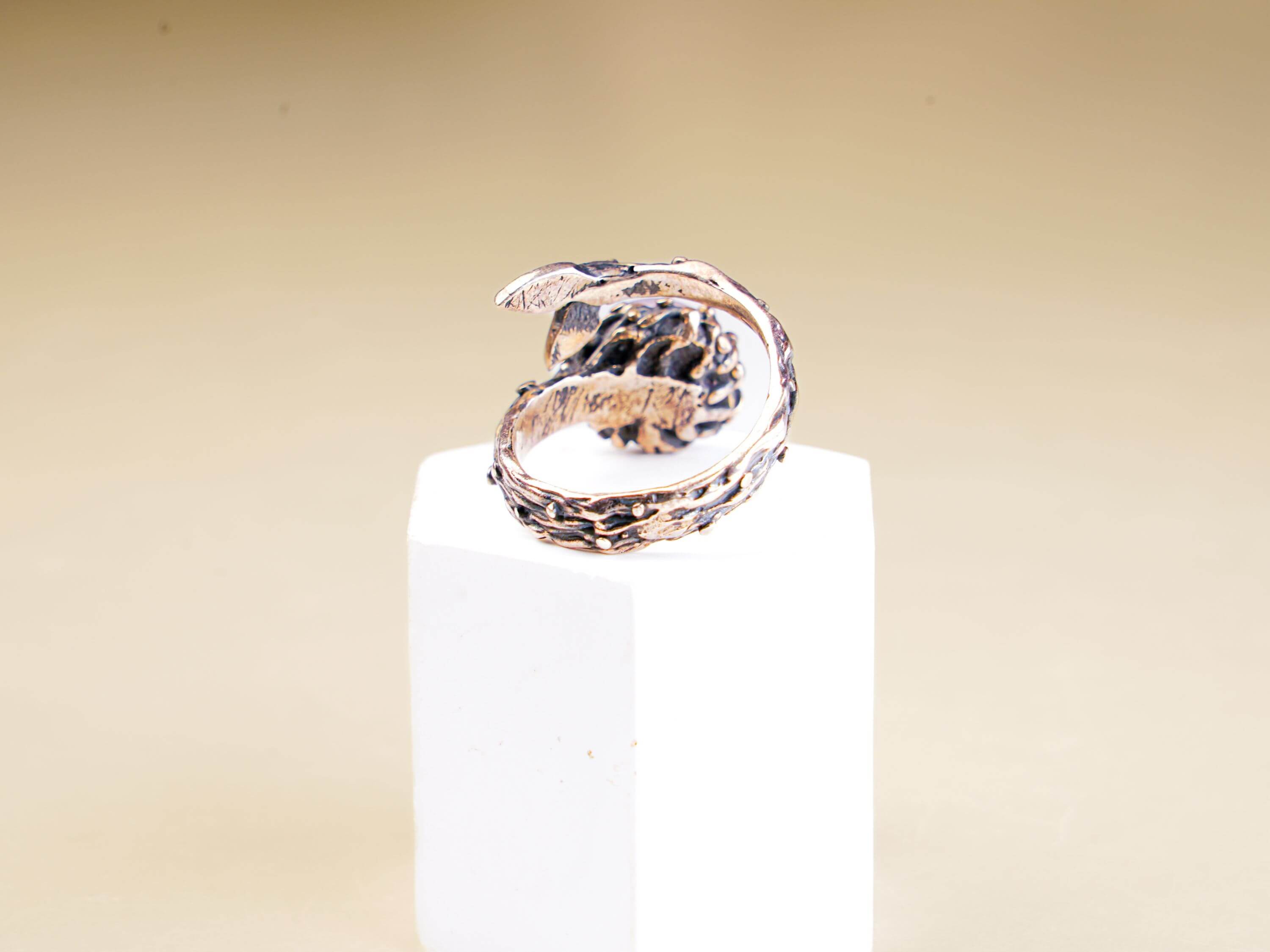 Functional view of the adjustable open-back silver band for a rose quartz statement ring