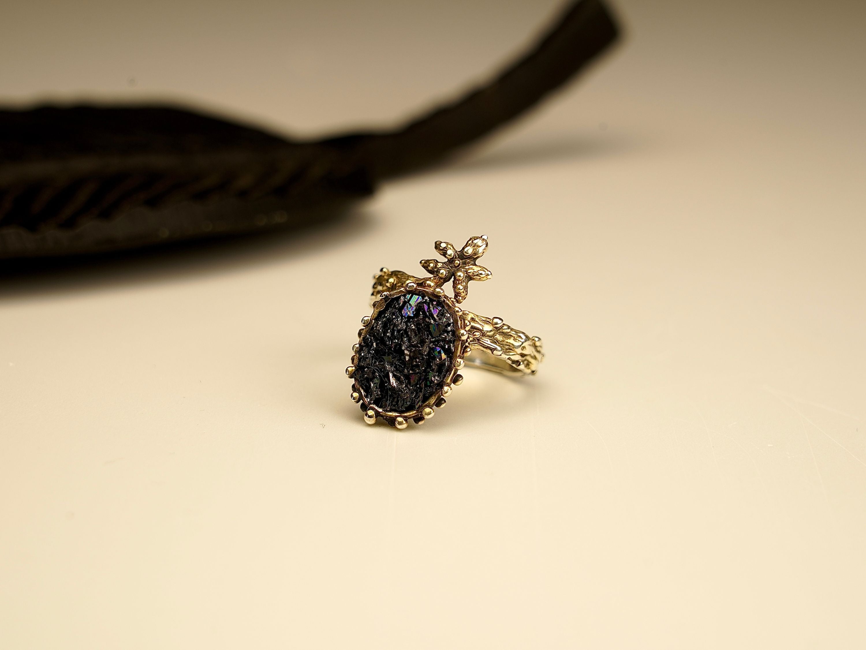 Angle view black tourmaline ring sculptural silver design artistic statement ring