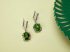 Angle view jade earrings green gemstone silver leverback earrings perspective