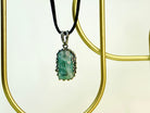 Angle view aquamarine pendant raw blue gemstone silver necklace elegant perspective