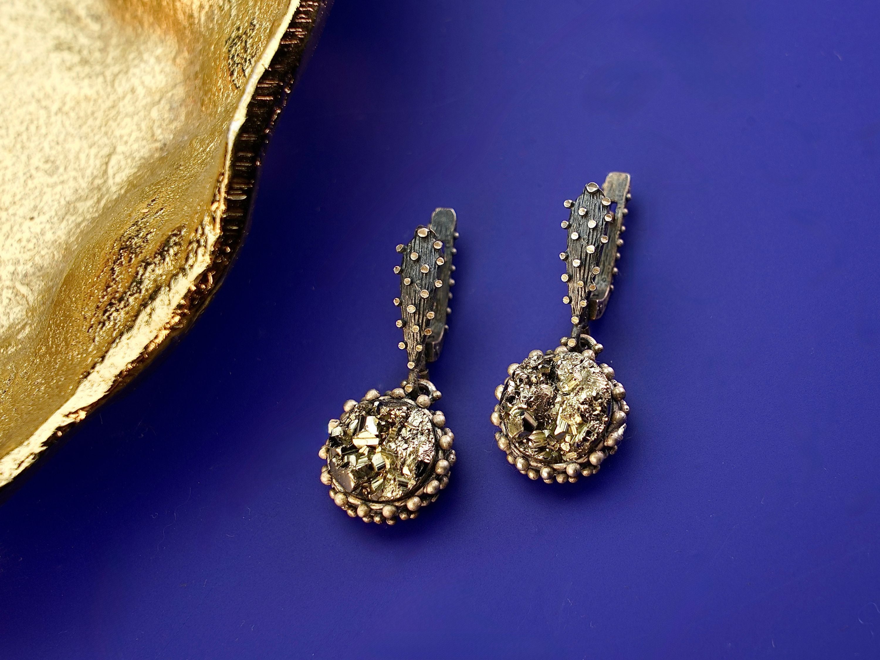 Angle view pyrite earrings metallic gold cluster silver earrings perspective