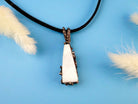 Angle view moonstone pendant raw white gemstone silver necklace elegant perspective