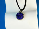 lapis lazuli pendant angled view, refined silver and blue gemstone design