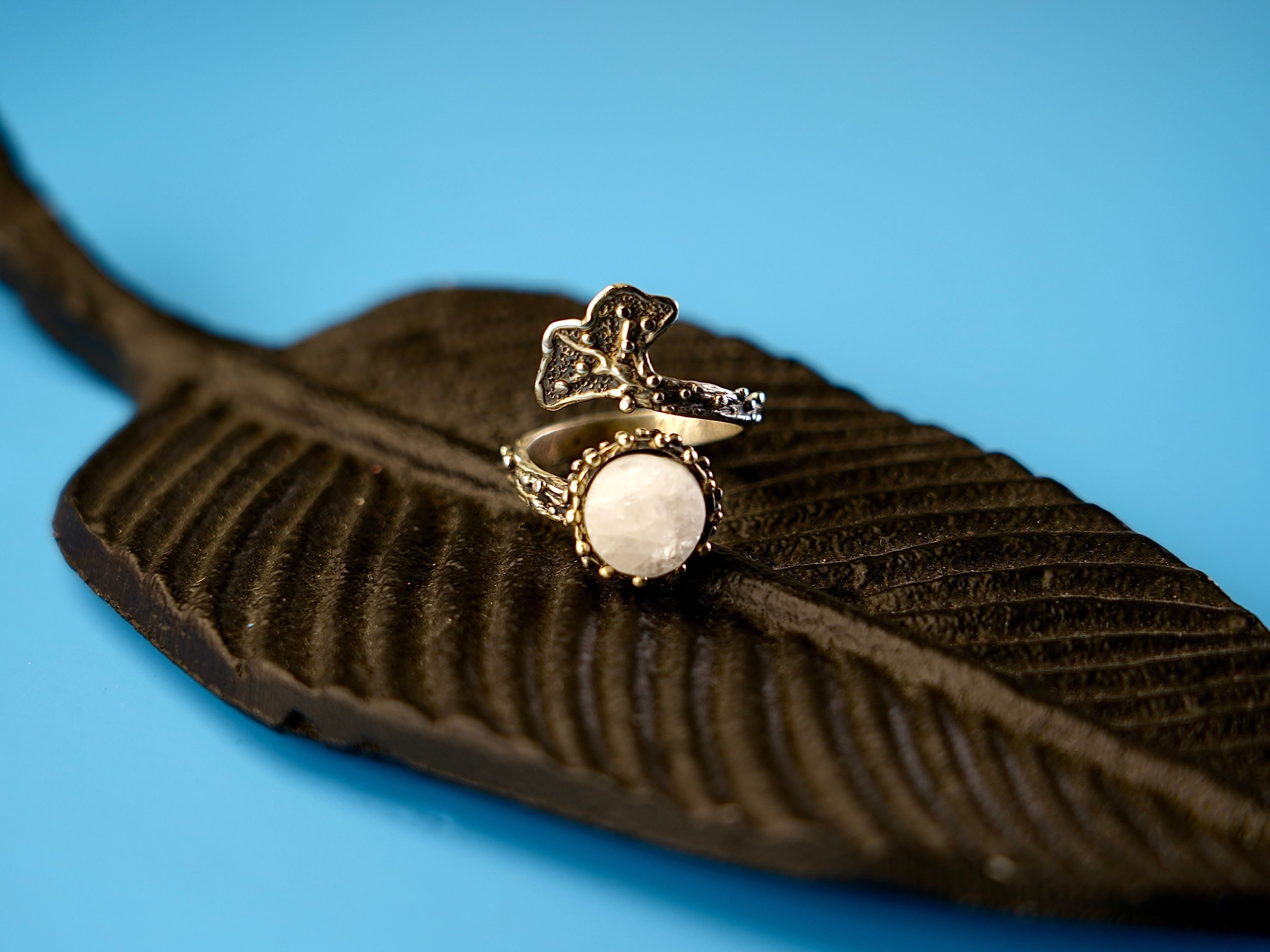 Angle view moonstone adjustable ring polished stone silver design elegant statement jewelry