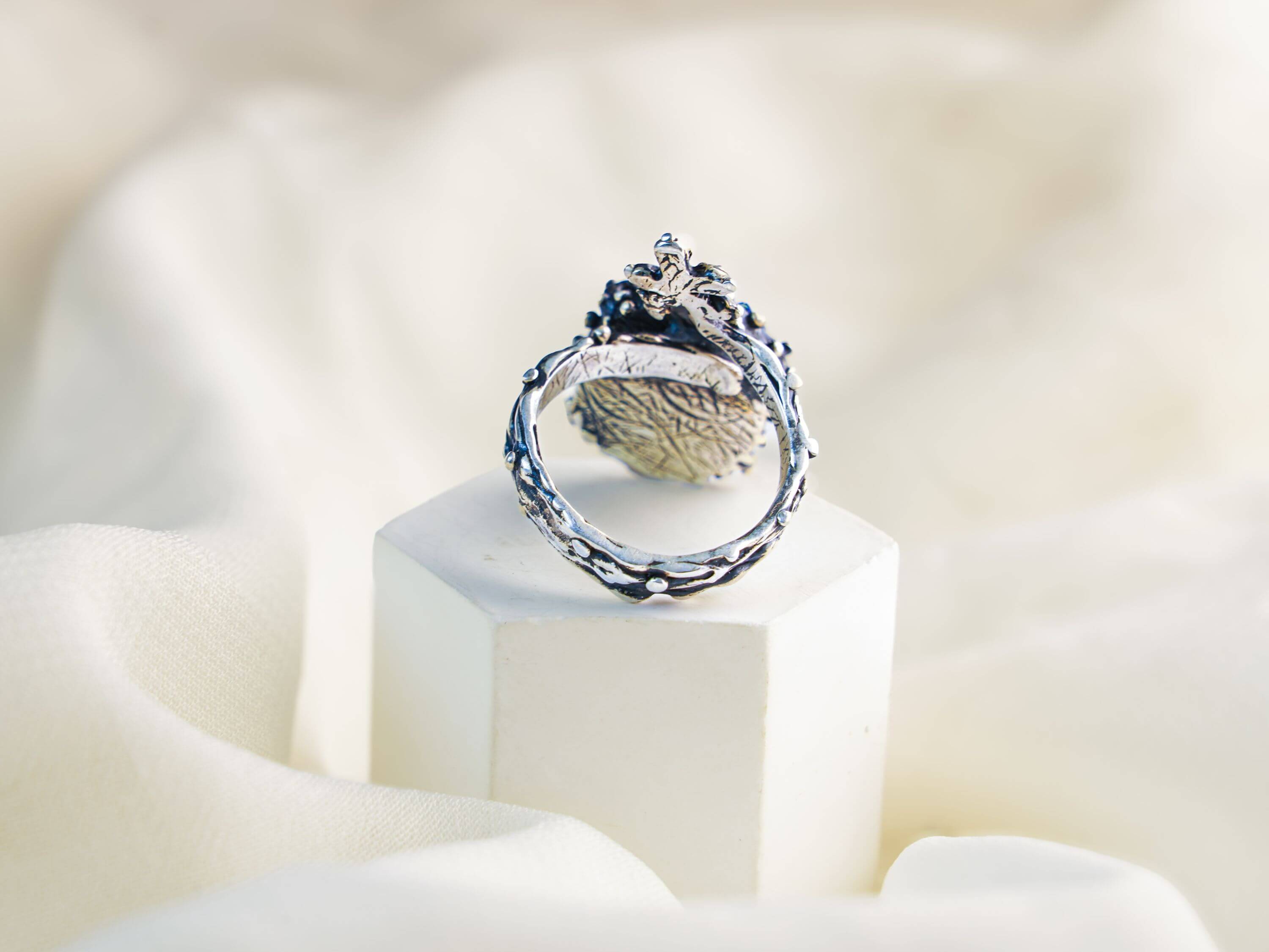 Close-up of the adjustable open-back silver twig band for the lapis lazuli statement ring