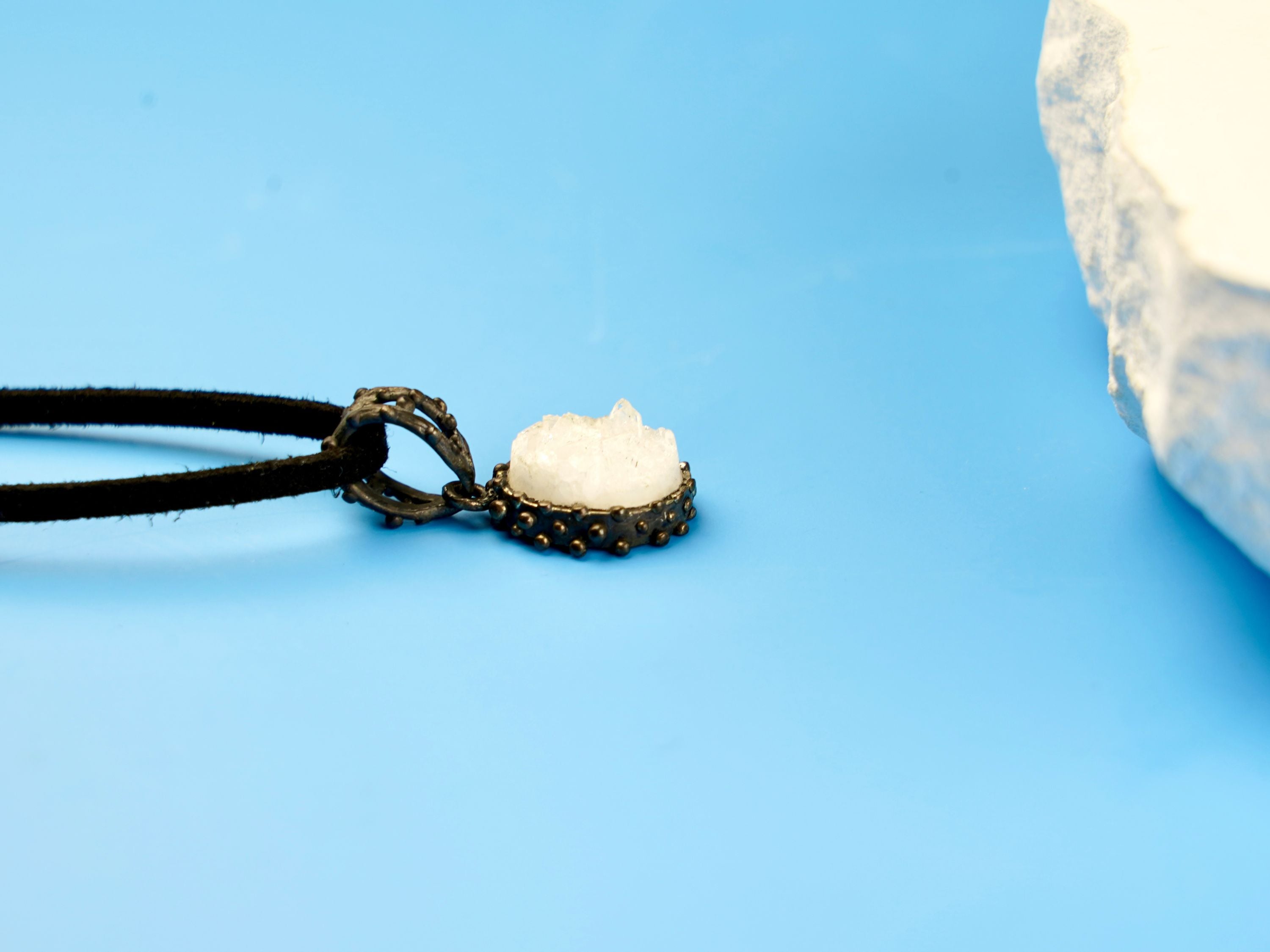 moonstone pendant side profile, gemstone depth and silver setting detail