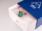 Akra Gems signature luxury blue and pink gift box packaging with malachite ring inside