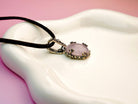 Rose quartz necklace side view pendant thickness sterling silver pink stone