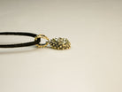 gold pyrite pendant angle view sterling silver handmade jewelry