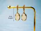 Side profile moonstone drop earrings length and structure silver earrings detail