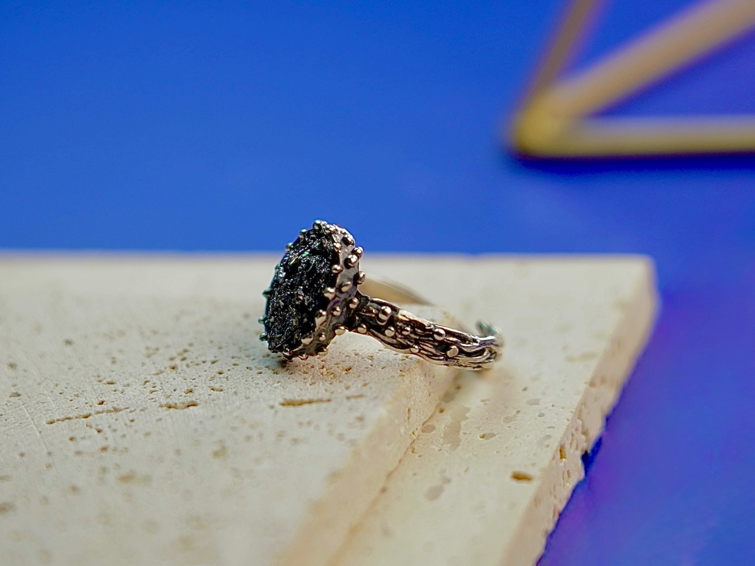 Side profile raw tourmaline ring adjustable band structure sterling silver detail