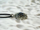 tourmaline pendant side profile, sculptural silver setting and crystal depth