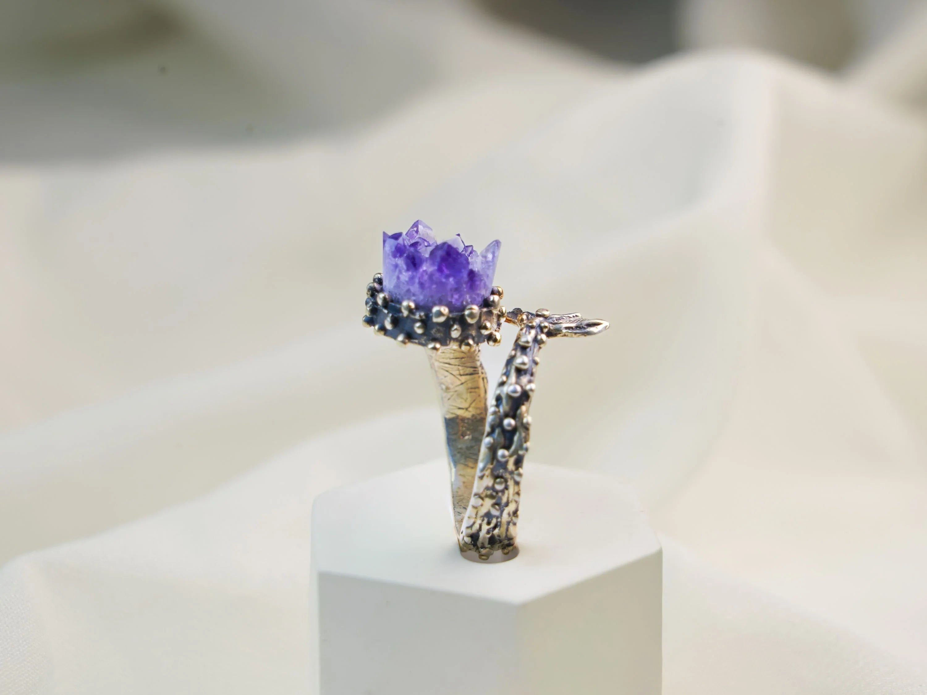 Amethyst ring vertical view showing band and gemstone structure
