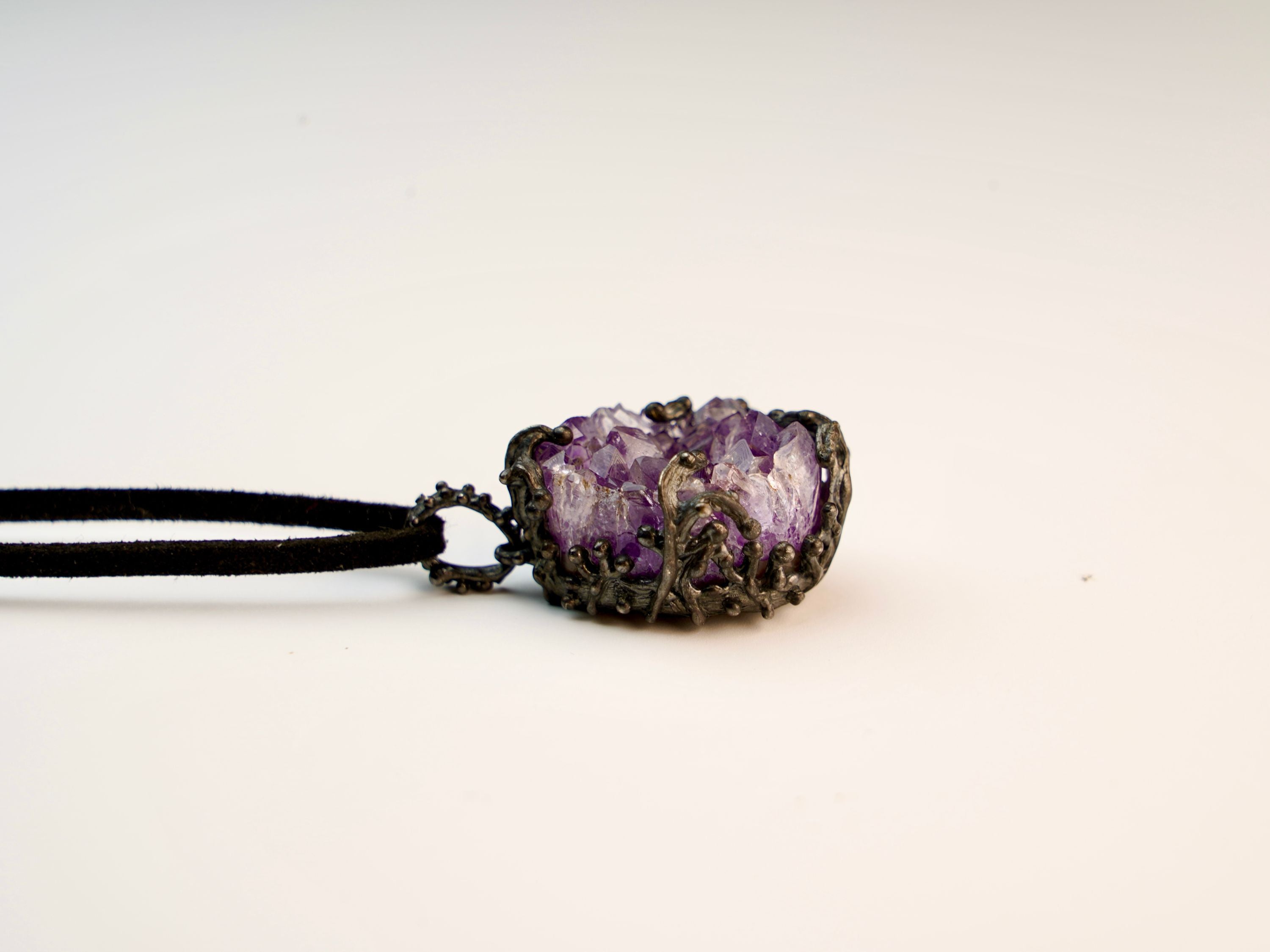 amethyst pendant side profile, raw crystal depth and silver setting detail