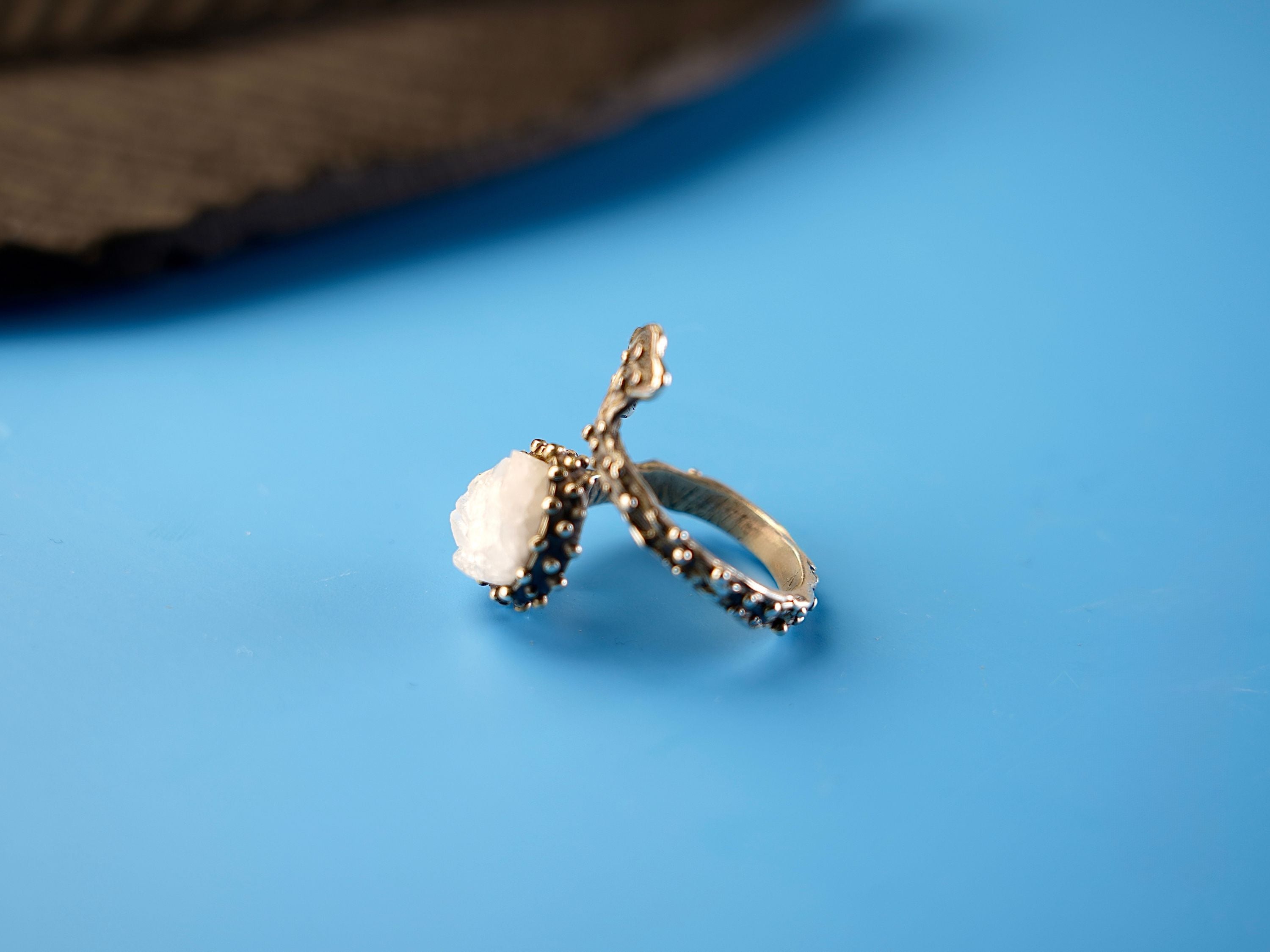 Side profile moonstone ring adjustable band structure sterling silver detail