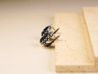 Black moissanite earrings side view sterling silver leverback design