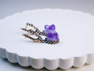 amethyst earrings side view silver setting gemstone drop earrings